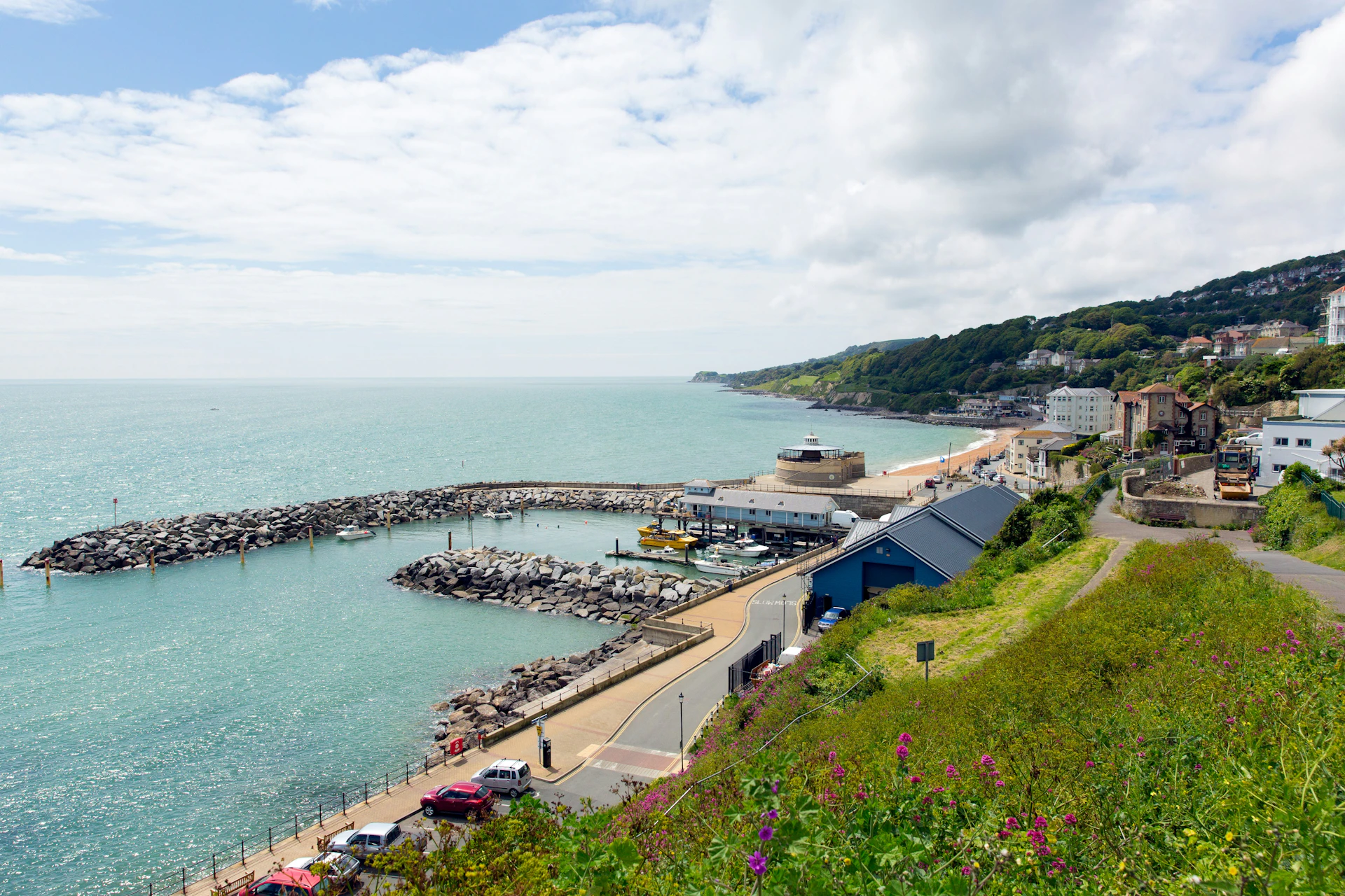 Ventnor, Isle of Wight seafront with Webb Jenkins orange brand colours as an overlay